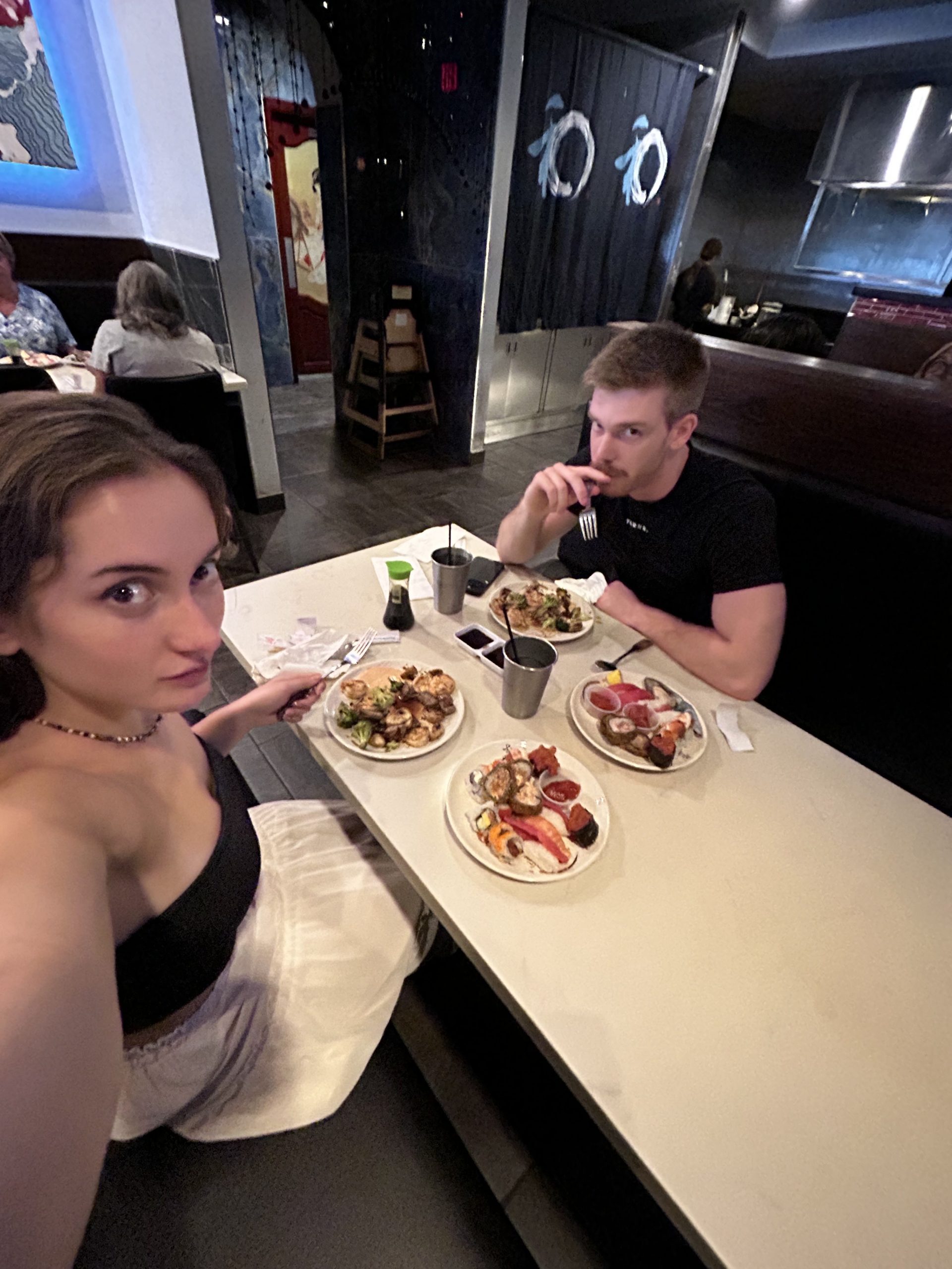 Emma and Dom eating sushi