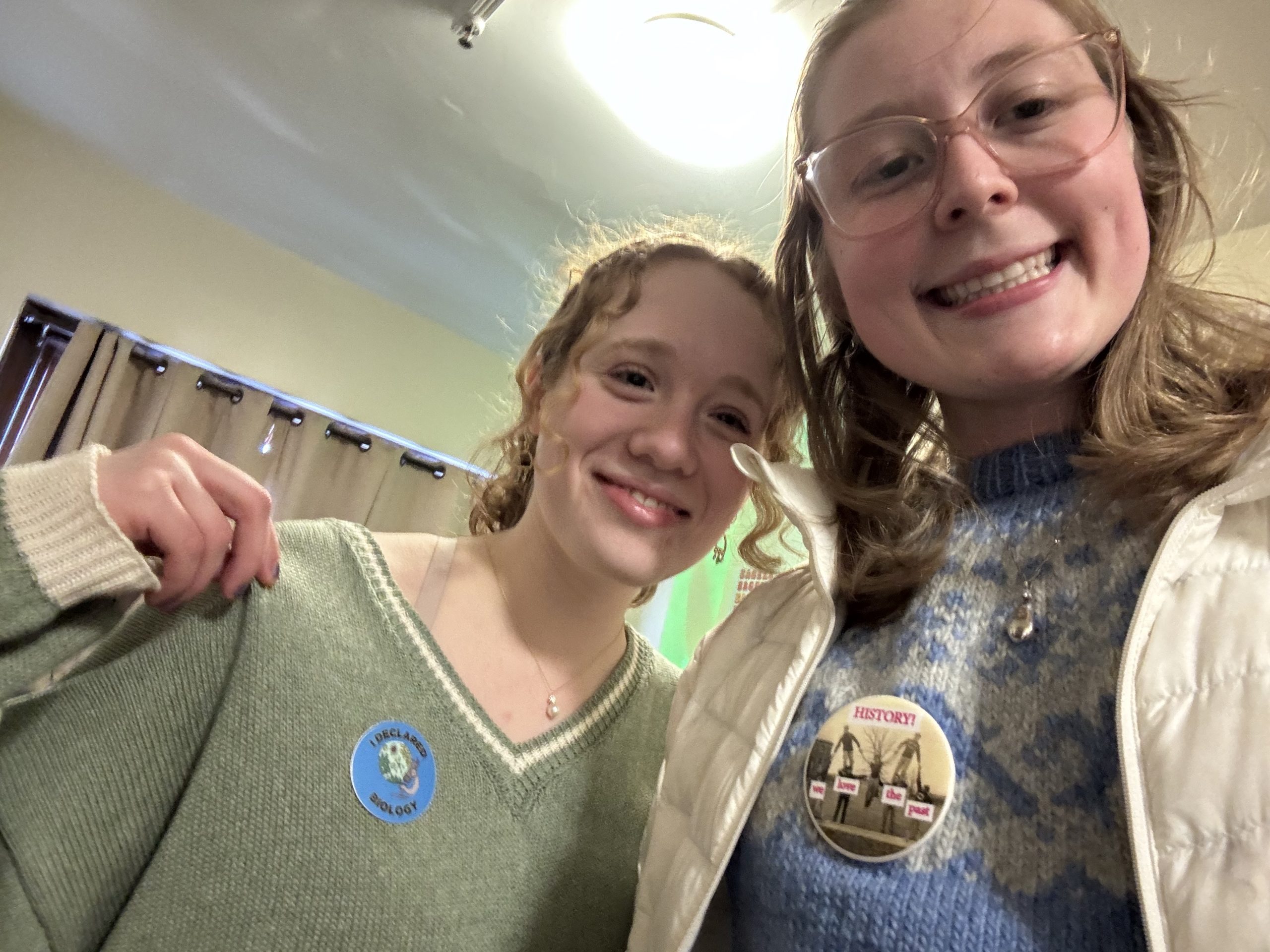 Two girls smiling with their declaration buttons!