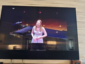 A student singing at showcase