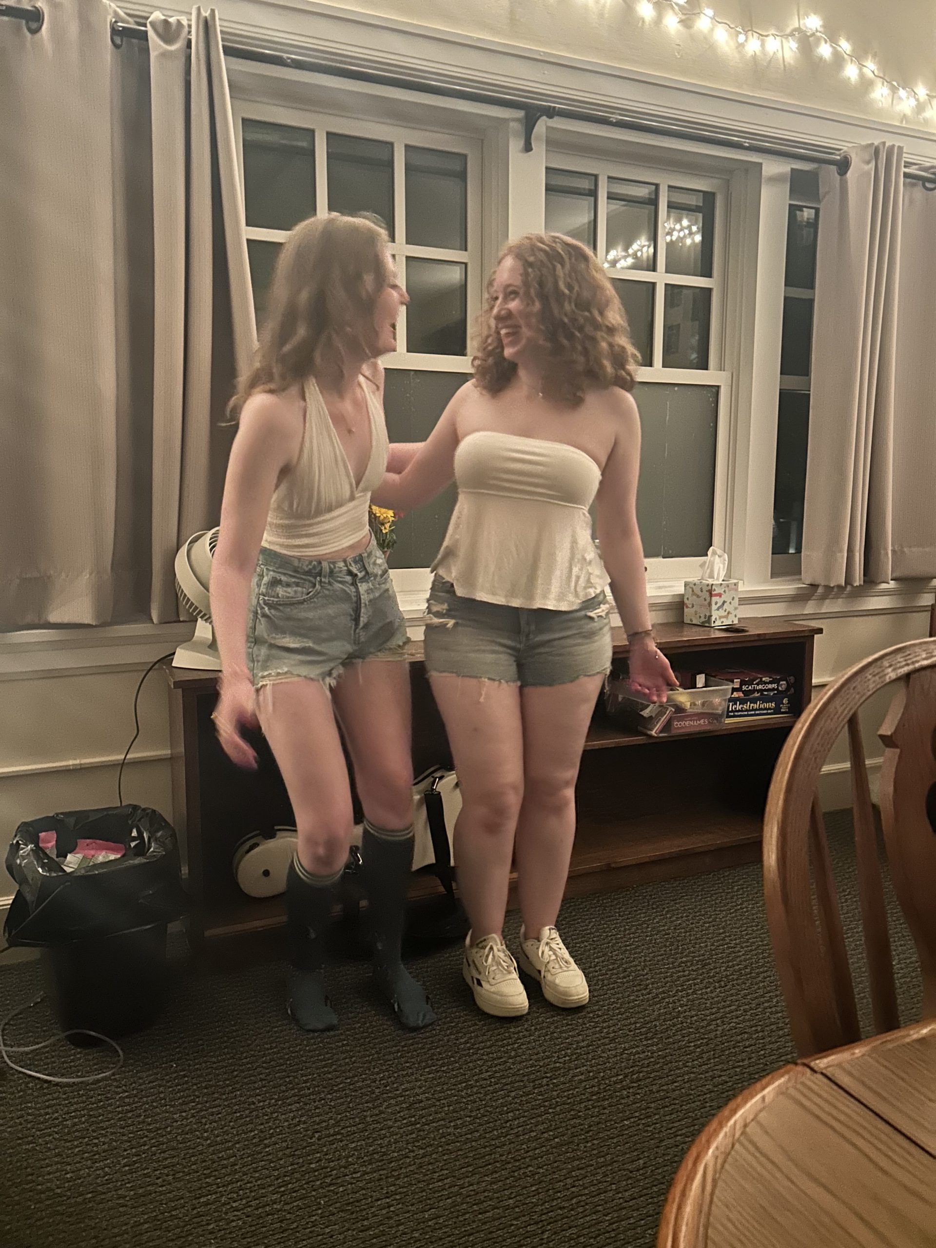 two girls laughing at each other