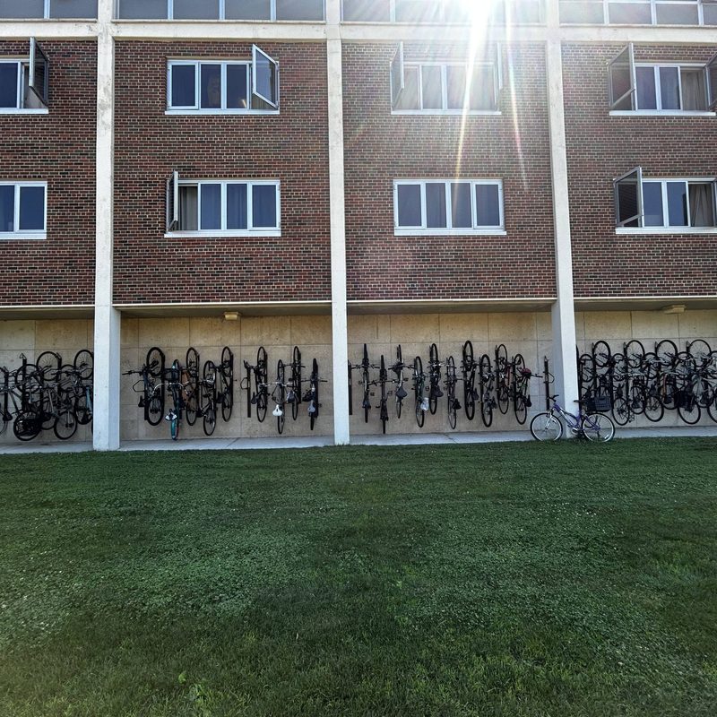 Myers Hall, a Carleton residential hall, with the outside bike hangers full.