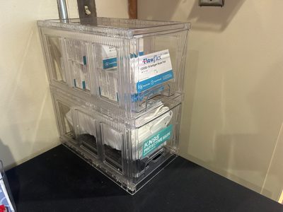 A container with free masks and Covid tests.