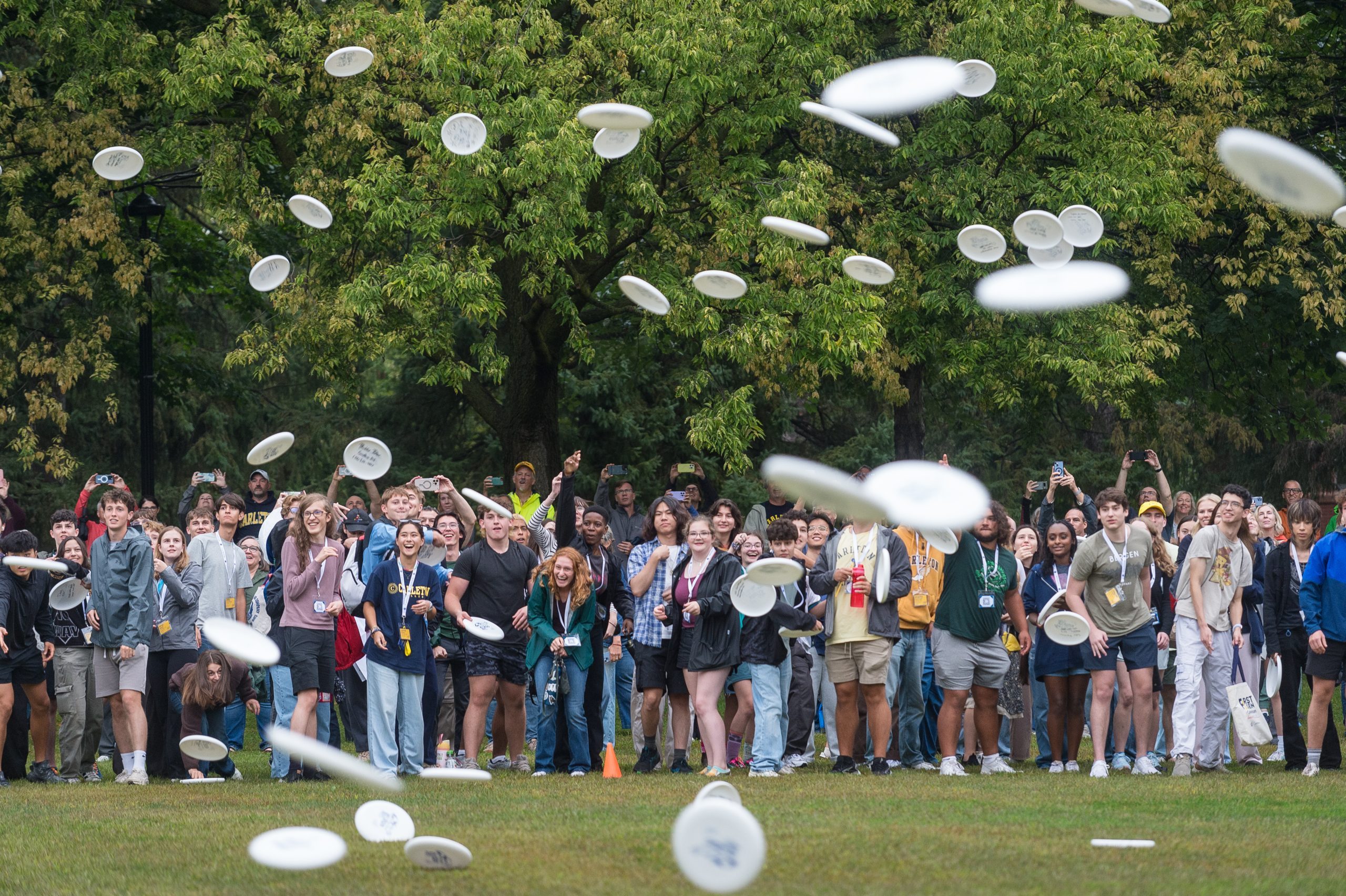 new students join in the annual frisbee toss