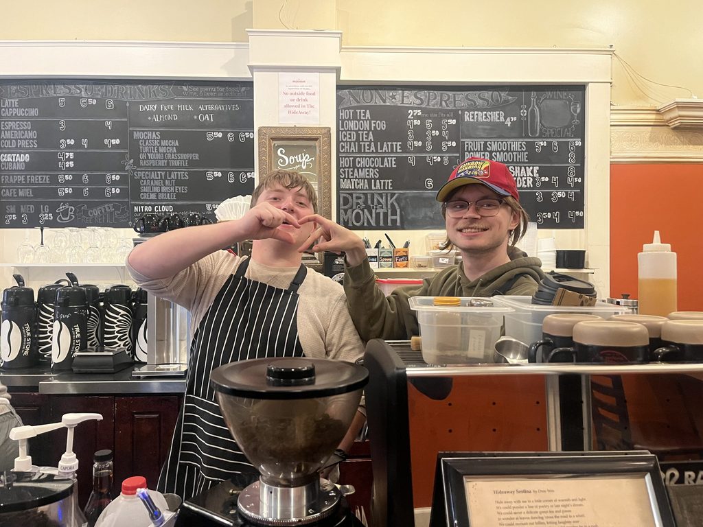 Two students moonlighting as baristas at a local coffee shop.