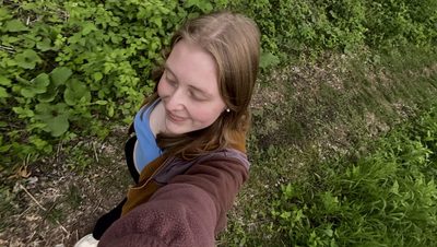 A girl walking in the arb