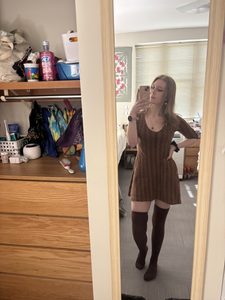 a girl wearing a brown dress