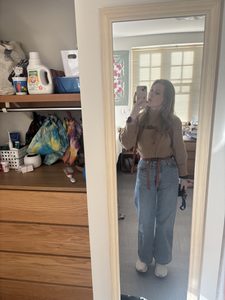 A girl wearing a sweater