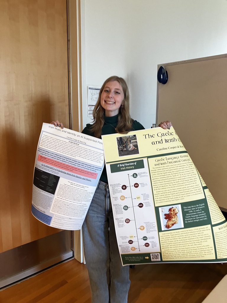 A student holding two posters