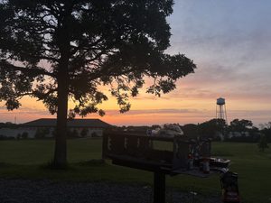 a sunset over the Carleton water tower