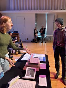 A student explaining the pop-up exhibit