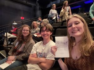 three students at the fall play