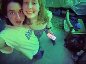 two students smiling at the camera