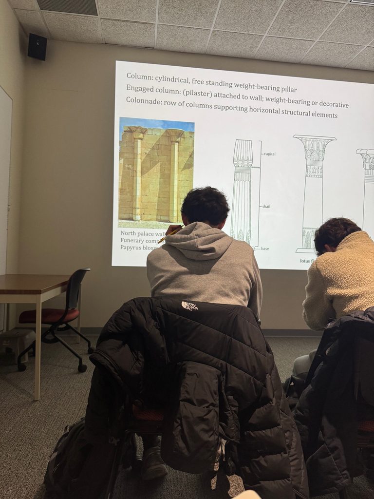 A photo from class of a slide presentation about different kinds of ancient Egyptian columns.