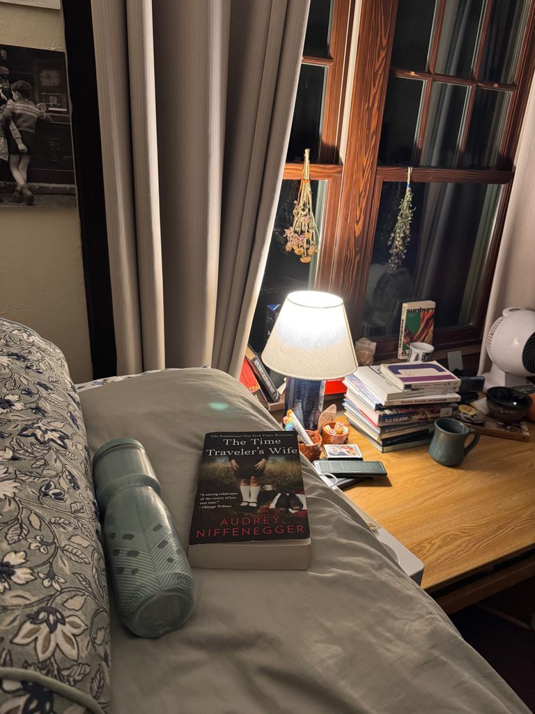 A bed with a book on it
