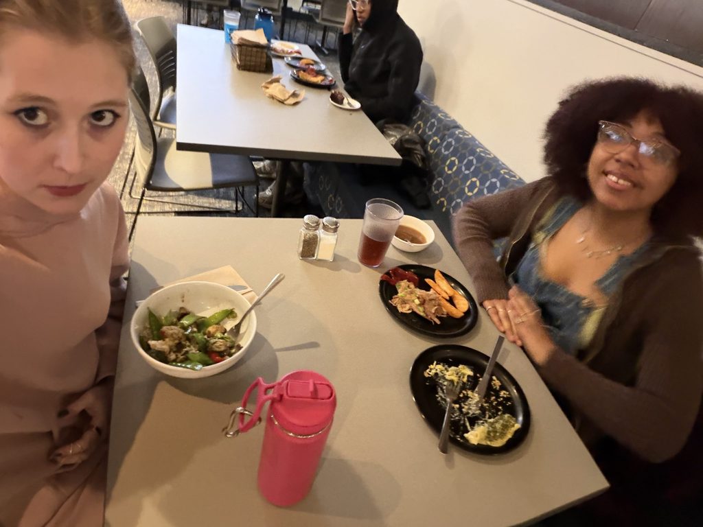 two girls eating dinner 