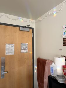 Suncatcher rainbows on wall