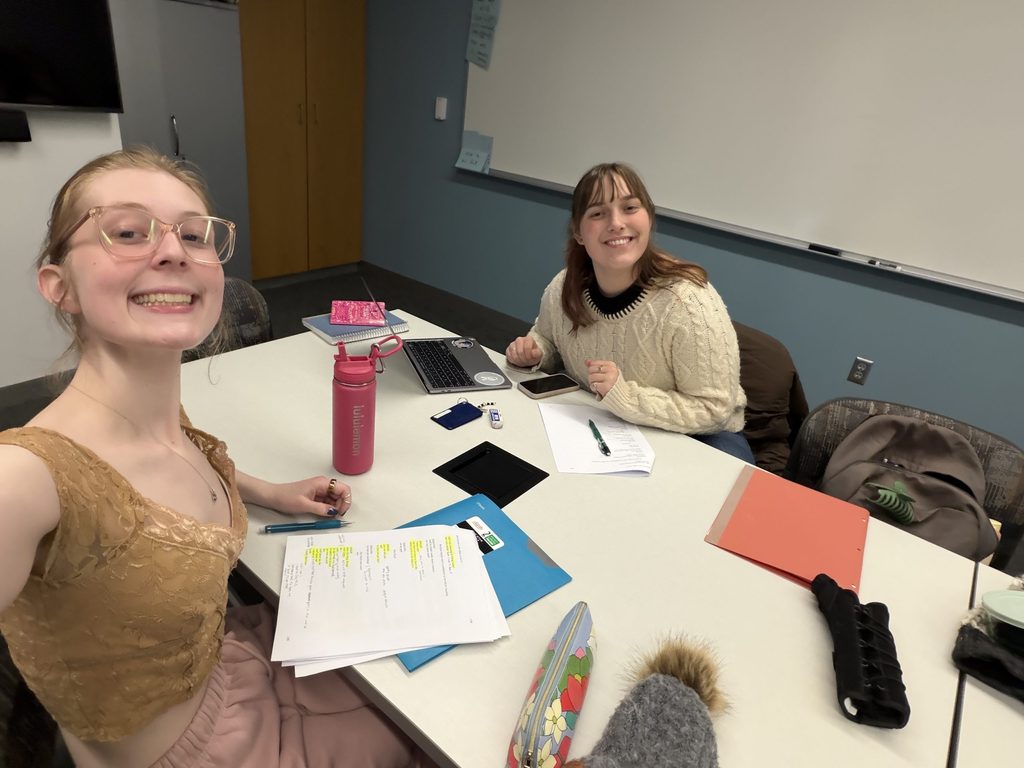 two girls working at a table