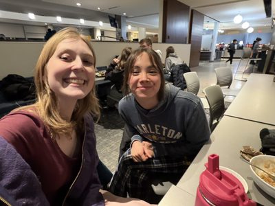 two girls smiling at the camera