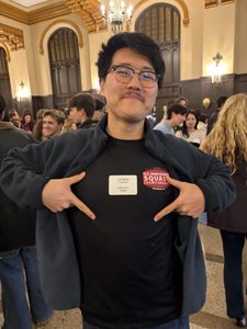 a student showing his name tag