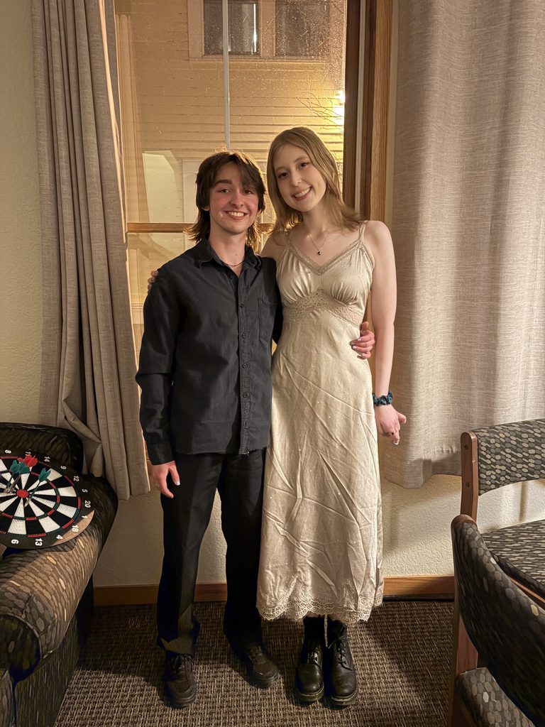 two students smiling at the camera