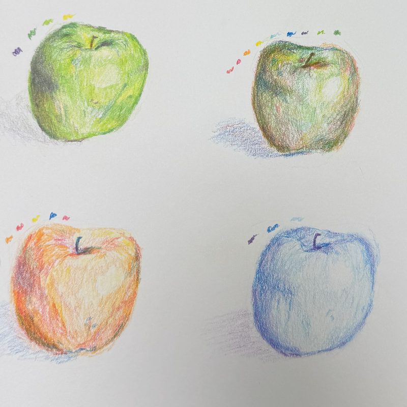 Four images of the same apple drawn in different color palettes: green, red, blue, and multicolored.