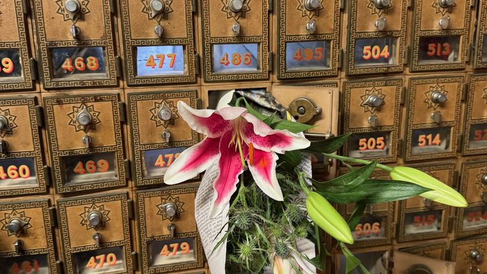 A bundle of flowers in an old-fashioned mailbox