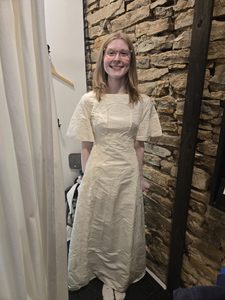 a girl in a thrifted dress