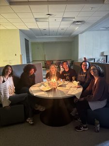 students around a cake