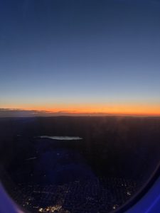 a sunrise outside a plane window