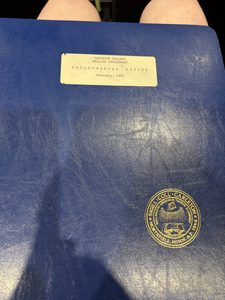 a binder reading "Carleton College English Departmental Review February, 1985"