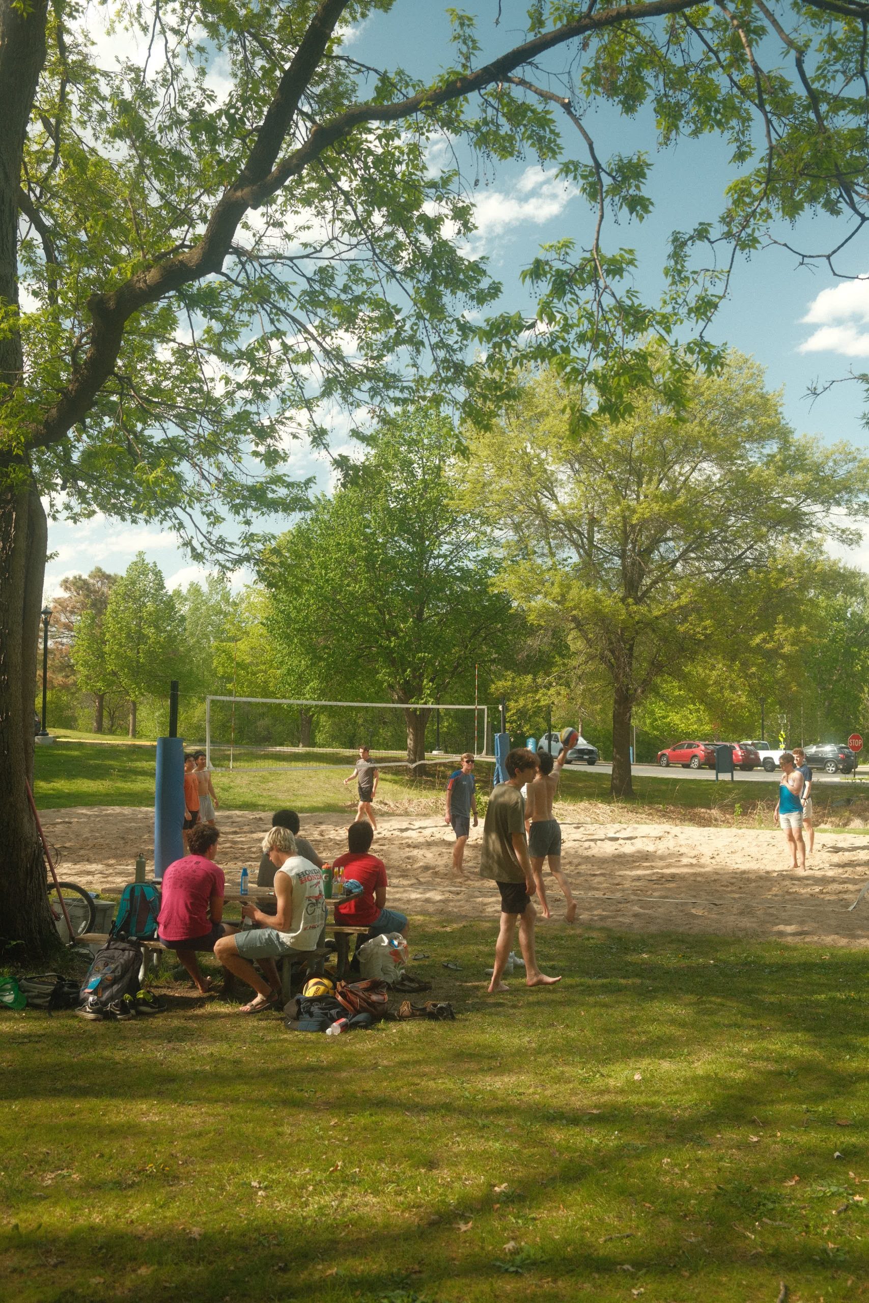 students enjoying beach volleyball