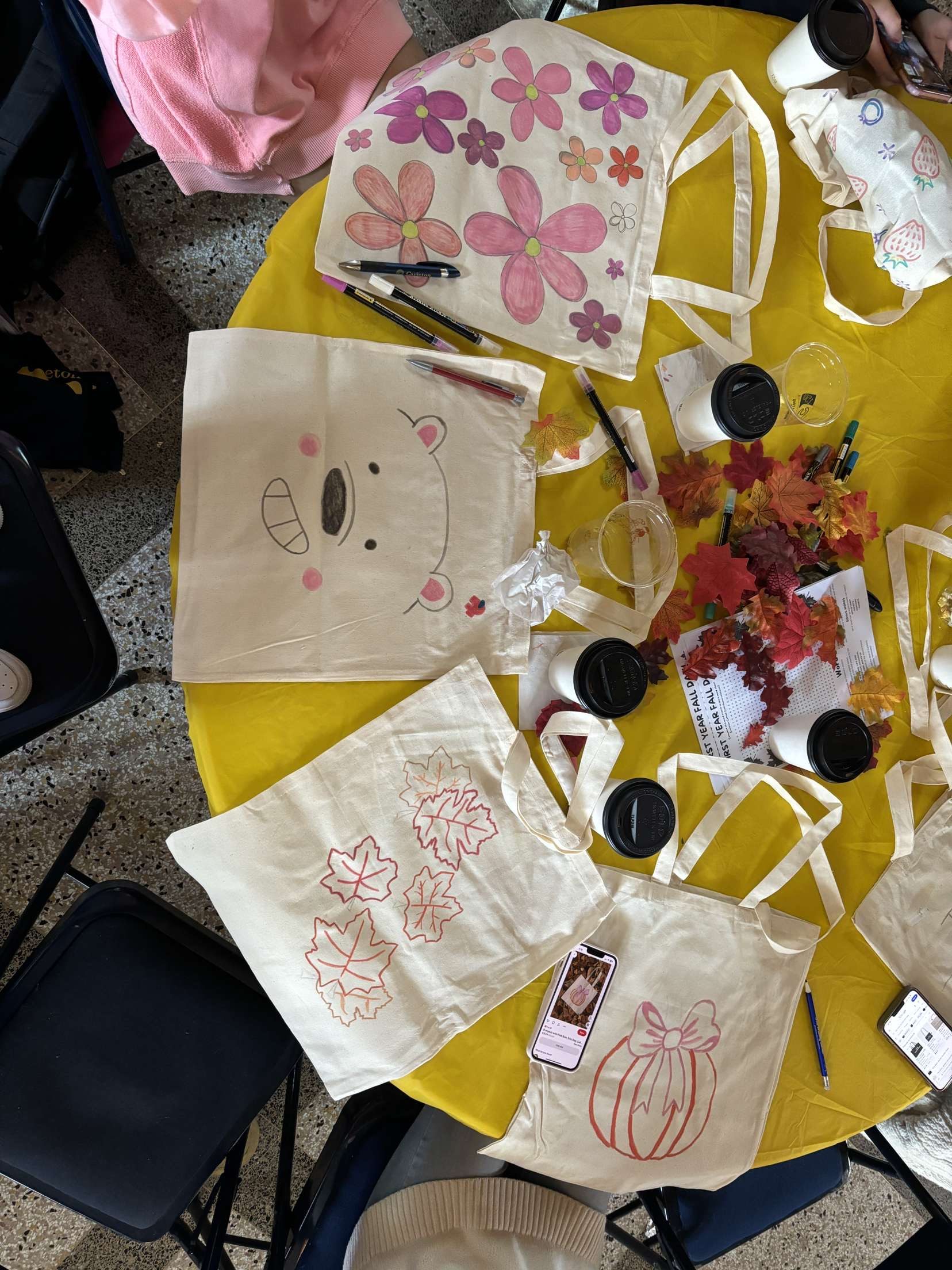 four decorated tote bags