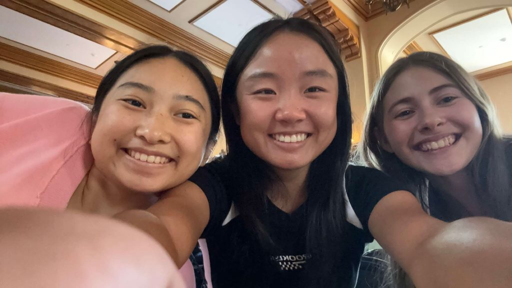 three girls smiling