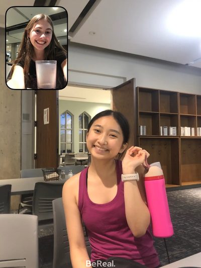 two girls smiling with waterbottle and cup