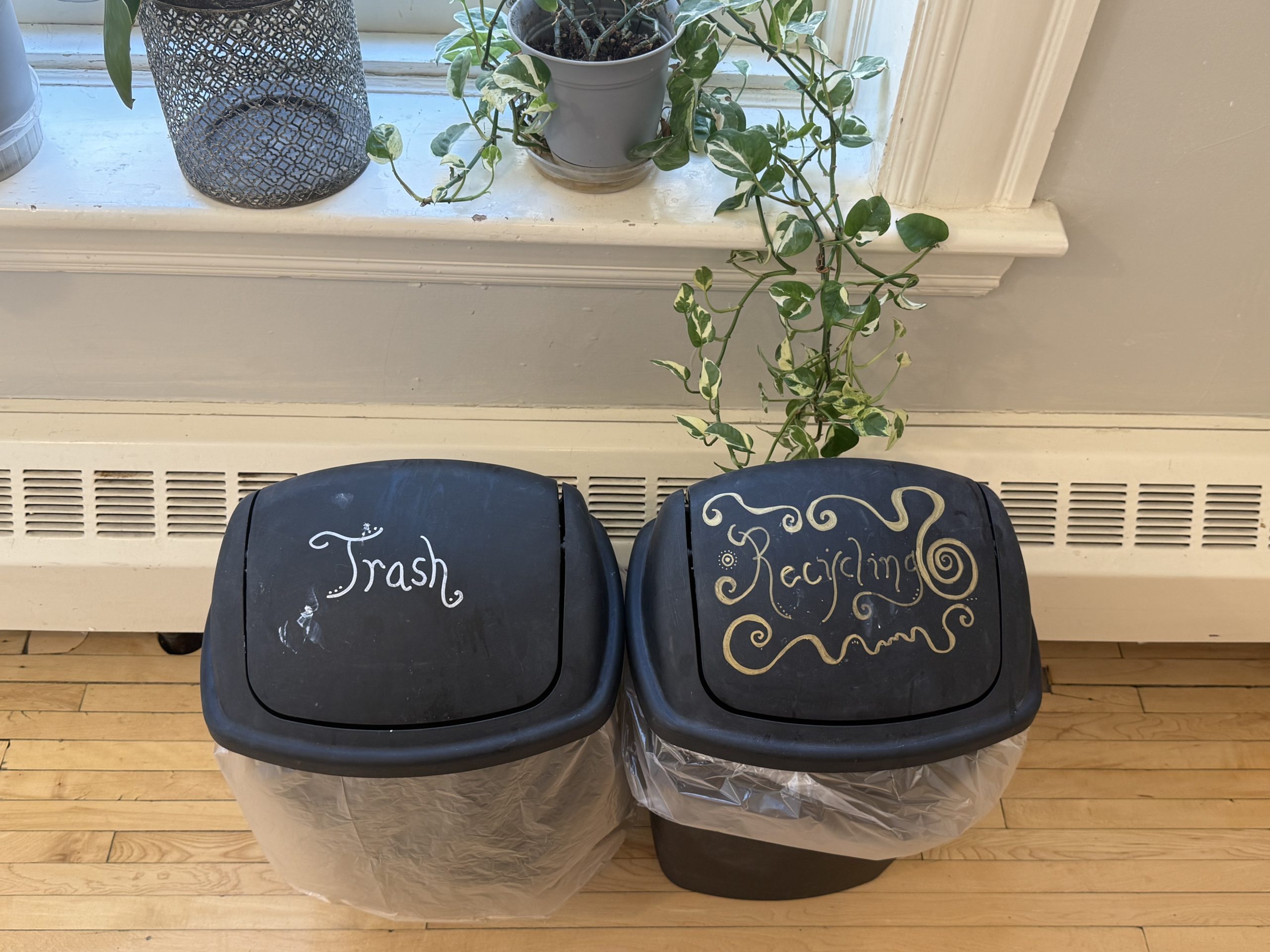 Two artistic rubbish bins