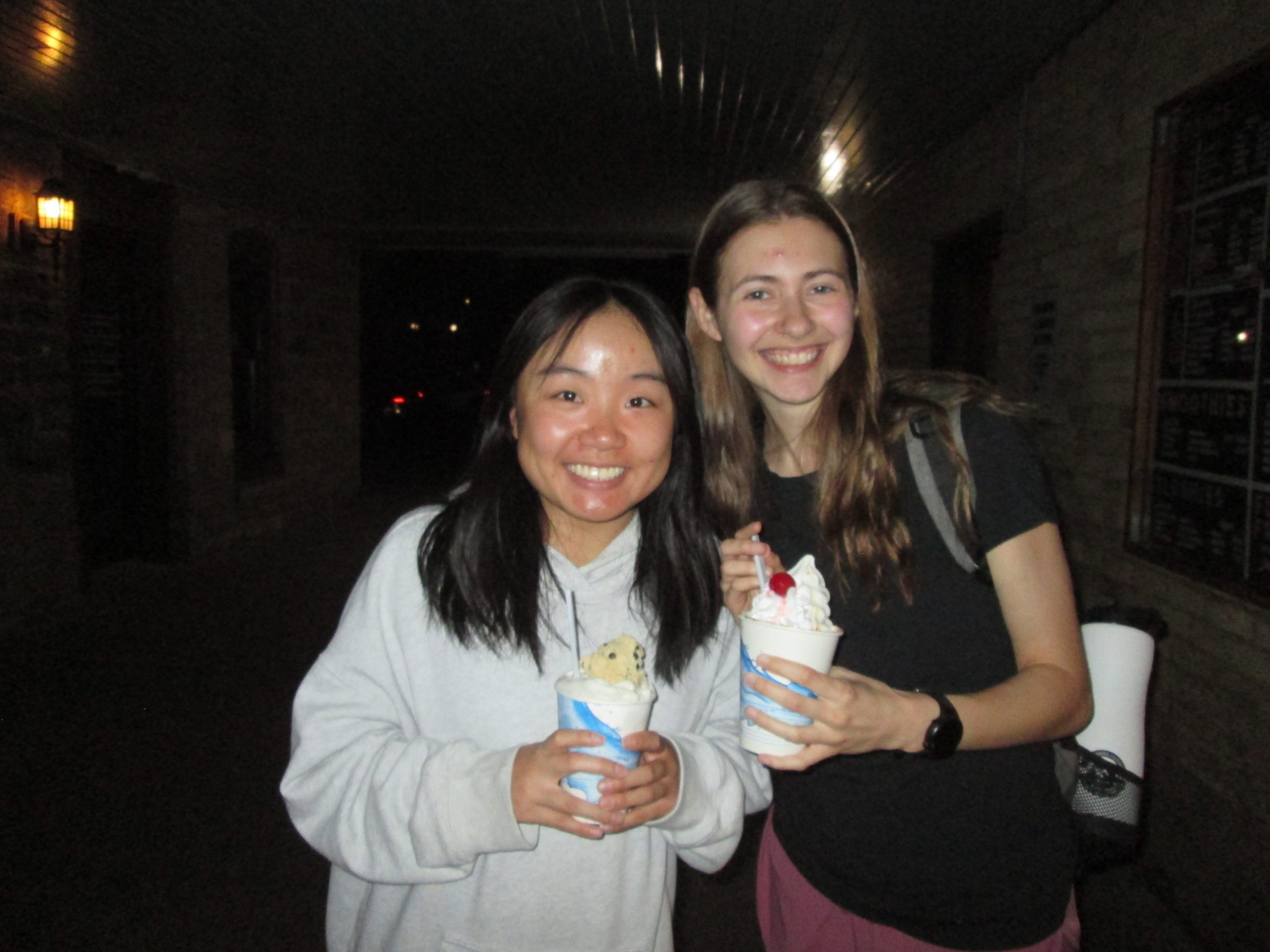 two girls smiling with ice cream
