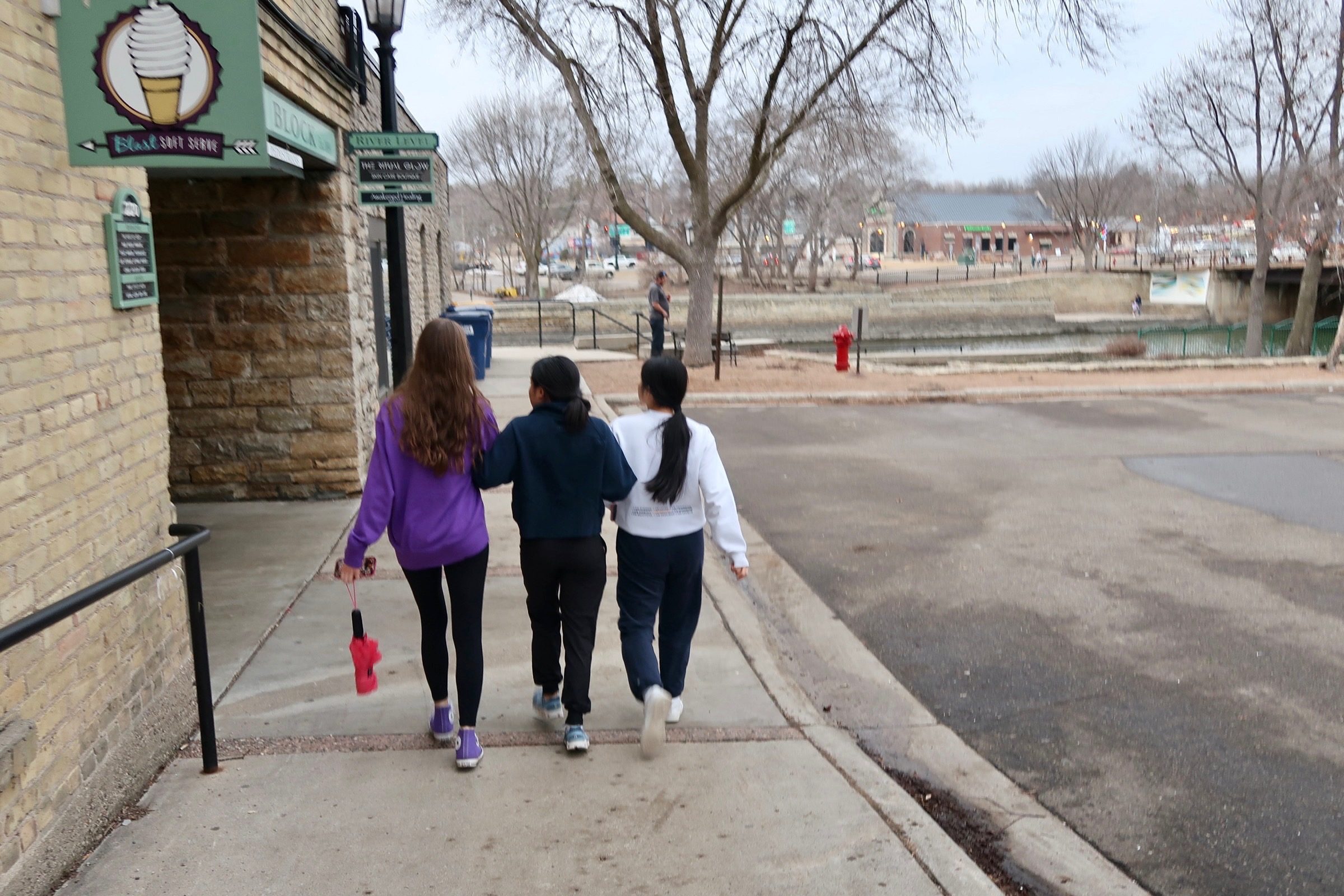 three girls walking downtown