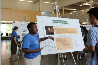A student presenting a research poster.