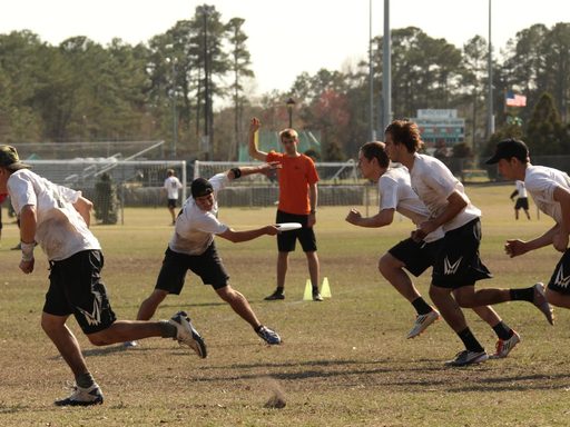 Carleton frisbee players in the middle of a play