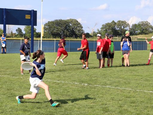 Students practicing Frisbee skills