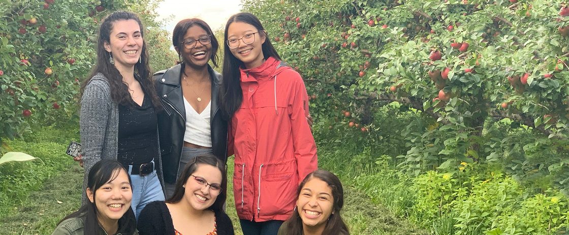 students in an apple orchard