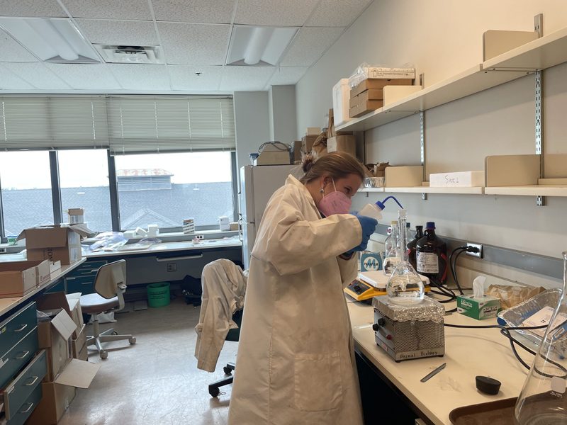 Grace preparing a stock solution.