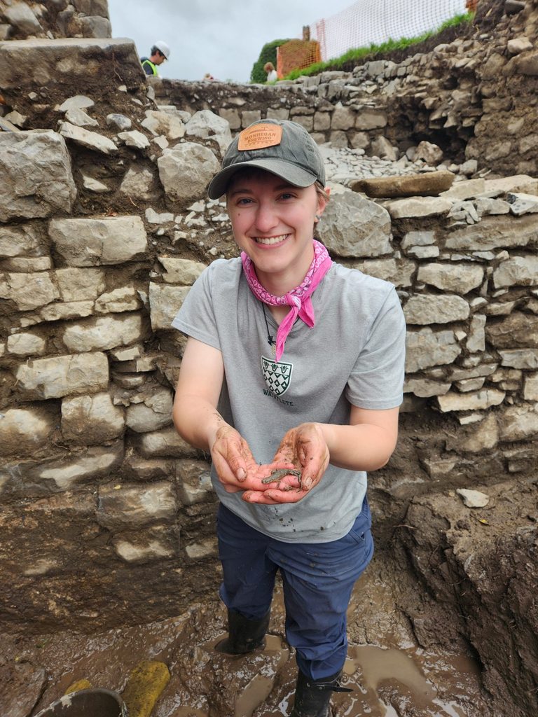 Calla in dig site holding amphibian