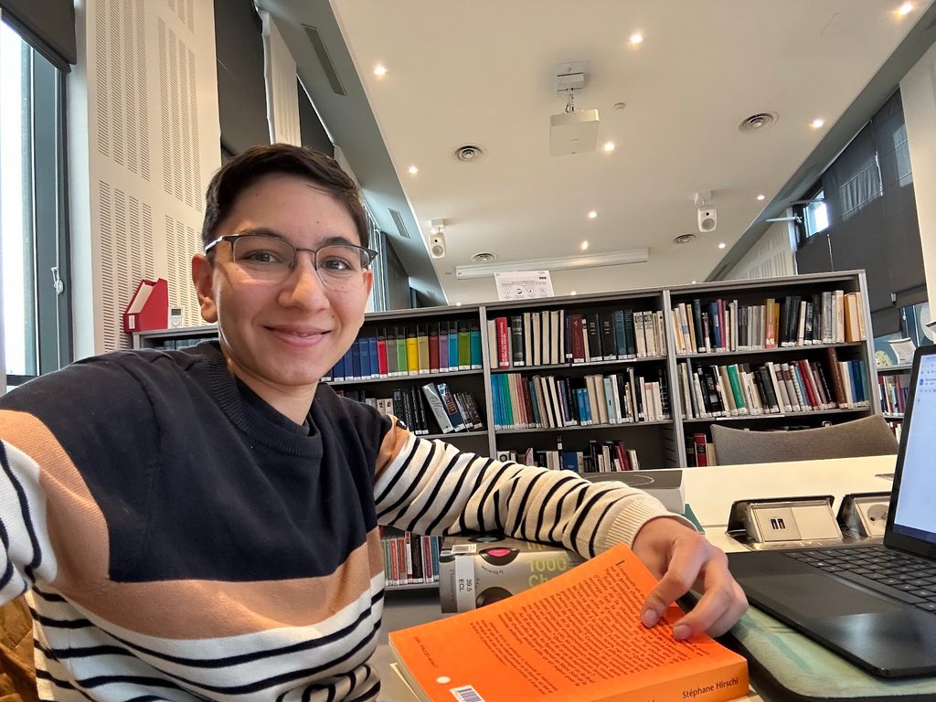Sarah in library with books