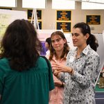 Undergraduate student presenting research at a poster during the 2025 Carleton College Undergraduate Research Symposium.