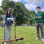 Matilda (left) is testing the electrical resistance of the ground, while Charlie (right) “cord-wrangles.”