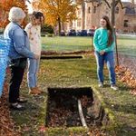 Students showing excavation hole