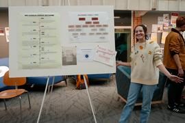 Student with their poster