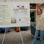 Student with their poster
