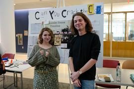 two students with their research poster